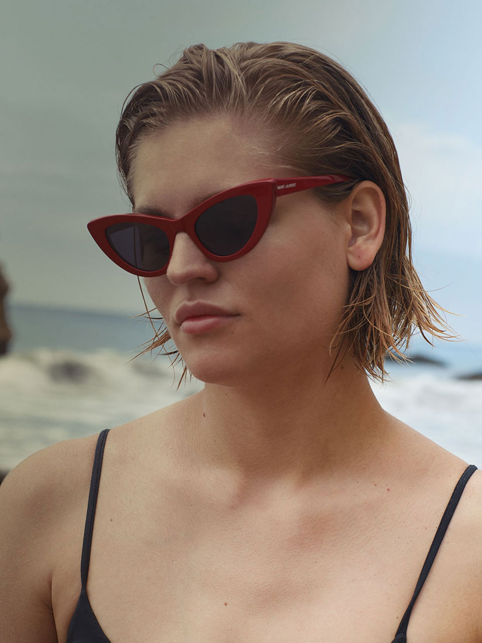 ‘Daria’ and Fred Jacobs are on the beach — Swimwear Tavik Sunglassses Yves Saint Laurent